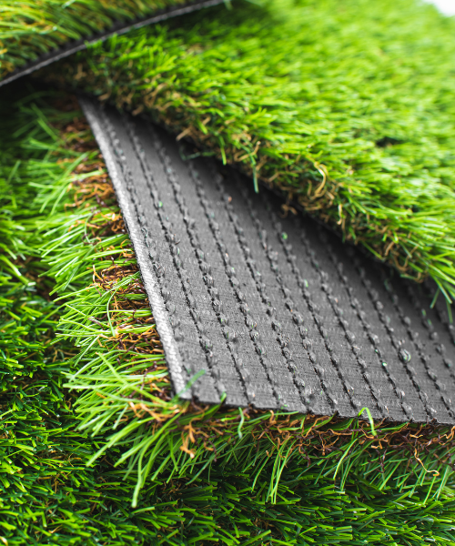 A close up of a grass mat laying on the ground